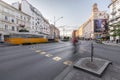 Karoly street circle or KÃÂ¡roly kÃÂ¶rÃÂºt twilight street view with 49, 47 yellow vintage tram and a cyclist passing by, in Budapest