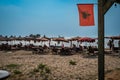 Karpen, Durres Albania - 23 august 2023: view at Karpen beach with waving albanian flag in front, travel concept foto