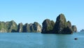 Karst landforms in the sea, the world natural heritage - halong bay in Vietnam at sunset. Natural and travel landscape