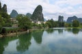 Karst mountains reflected in Yulong river Royalty Free Stock Photo