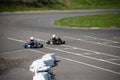 Kart racers compete for position on compititon