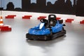 Karting area with barriers and small blue kart Royalty Free Stock Photo