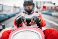 Karting race, go cart driver in helmet