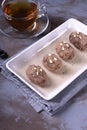 Kartoshka cake on the ceramic platter on the grey wooden table Royalty Free Stock Photo