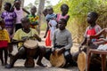 Unidentified Diola boy plays on drums in Kaschouane village. Di