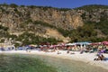 Kash, Turkey - November 14, 2022: Ada beach on the Mediterranean coast of Turkey. Swimming and resting tourists in the
