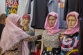 Elderly Iranian woman near dummies, Kashan, Iran.