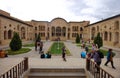 The main courtyard of Tabatabaei House with people visiting.