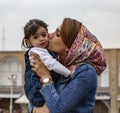 Kashan, Iran - 2019-04-14 - Naqshe Cehan Square mother kissed reluctant child Royalty Free Stock Photo