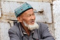 Portrait of an elderly, bearded man of the uyghur minority
