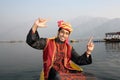 Kashmiri Boy Dancing to a Folk Song on a Shikara Royalty Free Stock Photo