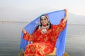 Kashmiri Girl Lifting her Blue Veil Royalty Free Stock Photo