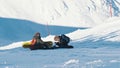 Two Skiers Sitting On A Snow-Covered Mountain - Skiers Taking A Break