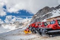 Kassbohrer PistenBully 600 snow groomers waiting at the hillside on Zugspitze mountain in the European Alps on a sunny summer day