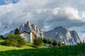 Kastelruth, Italy - 29 June 2018: The parc hotel Tyrol in town of Kastelruth, Castelrotto in Italy with dolomite background Royalty Free Stock Photo