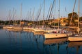 KASTOS island, GREECE-August,2019: Port of Kastos island with moored sailboats - Ionian sea, Greece in summer. Royalty Free Stock Photo