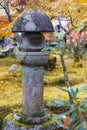 Kasuga doro or stone lantern in Japanese maple garden during autumn at Enkoji temple, Kyoto, Japan Royalty Free Stock Photo