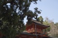 Kasuga-Taisha temple, torii, cherry blossoms and stone lanterns in Nara in Japan Royalty Free Stock Photo