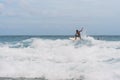 Kata beach, Phuket, Thailand - 16.06.2021: men catching waves in ocean, isolated Surfing action water board sport