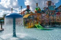 Kata`s Kookaburra Cove includes beginner`s body slides, water spouts and pools on sky cloudy background at Aquatica. Royalty Free Stock Photo