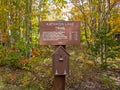 Katahdin Lake Trail sign includes nearby hiking trails and distances in early fall Royalty Free Stock Photo