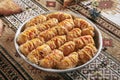 Kataifi, Kadaif or Kanafeh with Apple and Caramel on Vintage Traditional Tablecloth