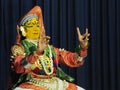 A Kathakali artist shows his Mudra and tells a story by changing the expression on his face.