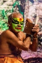 Kathakali exponent preparing for performance by applying face make-up. Kathakali is the classical dance form of Kerala