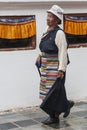 Unidentified Buddhist believers, mostly Tibetan exiles, turn clockwise around the Boudhanath stupa spinning the hundreds of prayer Royalty Free Stock Photo