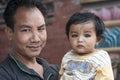 Unidentified nepalese man with his little child in the street of Kathmandu, Nepal