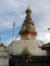 Vertical view of a golden stupa with the eyes of the Buddha in the Swayambhunath Temple, the monkey temple. Kathmandu, Nepal Royalty Free Stock Photo