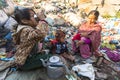 KATHMANDU, NEPAL - child and his parents during lunch in break between working on dump. Royalty Free Stock Photo