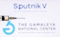 Kathmandu, Nepal - December 15 2020: Closeup of Syringe Injection full of vaccine against Sputnik V Gamaleya Logo Royalty Free Stock Photo