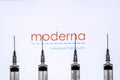 Kathmandu, Nepal - January 03 2021: Closeup of a syringe against Moderna logo