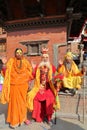 KATHMANDU, NEPAL - JANUARY 14, 2015: Portrait of Three Sadhus Holy man, one woman and two men in Durbar Square