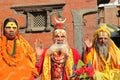 KATHMANDU, NEPAL - JANUARY 14, 2015: Portrait of Three Sadhus Holy man, one woman and two men at Durbar Square