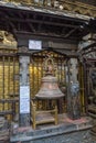 A large metal bell in an ancient Buddhist temple on April 13, 2018 in Kathmandu, Nepal. Royalty Free Stock Photo