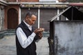 Kathmandu, Nepal - November 10, 2017. Man praying on street of Kathmandu in morning. Nepal is a poor financial country but reach Royalty Free Stock Photo