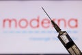 Kathmandu, Nepal - November 24 2020: Syringe Injection infront of Moderna Logo. Moderna vaccine has shown 94% effectiveness