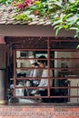 Kathmandu, Nepal - November 03, 2016: View of a Nepalese chef and sous chef working in the kitchen through a window