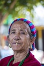 Elderly Nepali woman with traditional nose jewelry on the street market in Kathmandu, Nepal
