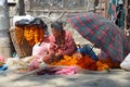 Kathmandu, Nepal, October, 10, 2013, Nepali Scene: Woman sells ritual flowers on the street in Kathmandu