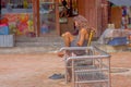 KATHMANDU, NEPAL OCTOBER 15, 2017: Unidentified man, homeless reading a book at outdoors sitting in a public metallic