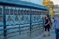 KATHMANDU, NEPAL OCTOBER 15, 2017: Unidentified people walking at outdoors close to Nepalese religious carvings and