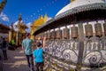 KATHMANDU, NEPAL OCTOBER 15, 2017: Unidentified people walking at outdoors close to Nepalese religious carvings and