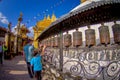 KATHMANDU, NEPAL OCTOBER 15, 2017: Unidentified people walking at outdoors close to Nepalese religious carvings and