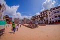 KATHMANDU, NEPAL OCTOBER 15, 2017: Unidentified people walking in a the square with lots of colorful souvenirs in street