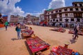 KATHMANDU, NEPAL OCTOBER 15, 2017: Unidentified people walking in a the square with lots of colorful souvenirs in street