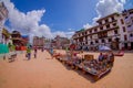 KATHMANDU, NEPAL OCTOBER 15, 2017: Unidentified people walking in a the square with lots of colorful souvenirs in street