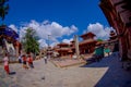 KATHMANDU, NEPAL OCTOBER 15, 2017: Unidentified people walking in the streets with a flock of pigeons at Durbar square Royalty Free Stock Photo